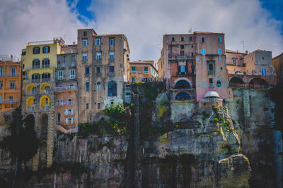 Buildings in city against sky