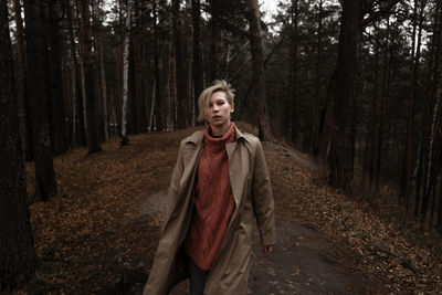 Portrait woman walking in forest