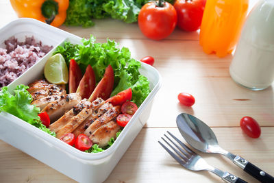 High angle view of chopped vegetables in bowl on table