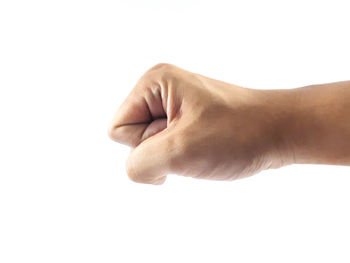 Close-up of hand over white background