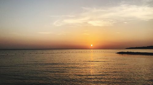 Scenic view of sea against sky at sunset