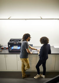 High angle view of colleagues working in office