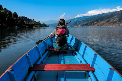 Rear view of a woman paddling