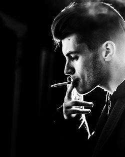 Close-up of man smoking cigarette