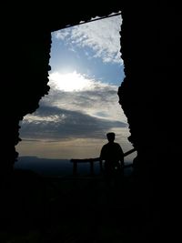 Silhouette man against sky during sunset