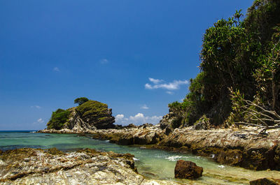 Beauty in nature, kapas island located in terengganu, malaysia under bright sunny day and cloudy sky