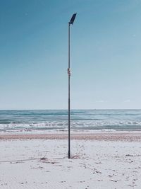 Scenic view of beach against clear sky