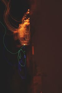 Close-up of illuminated water at night