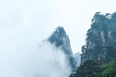 Low angle view of waterfall against sky