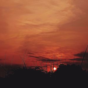 Scenic view of dramatic sky during sunset