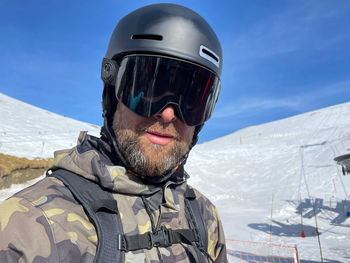 Portrait of a male snowboarder wearing ski googles