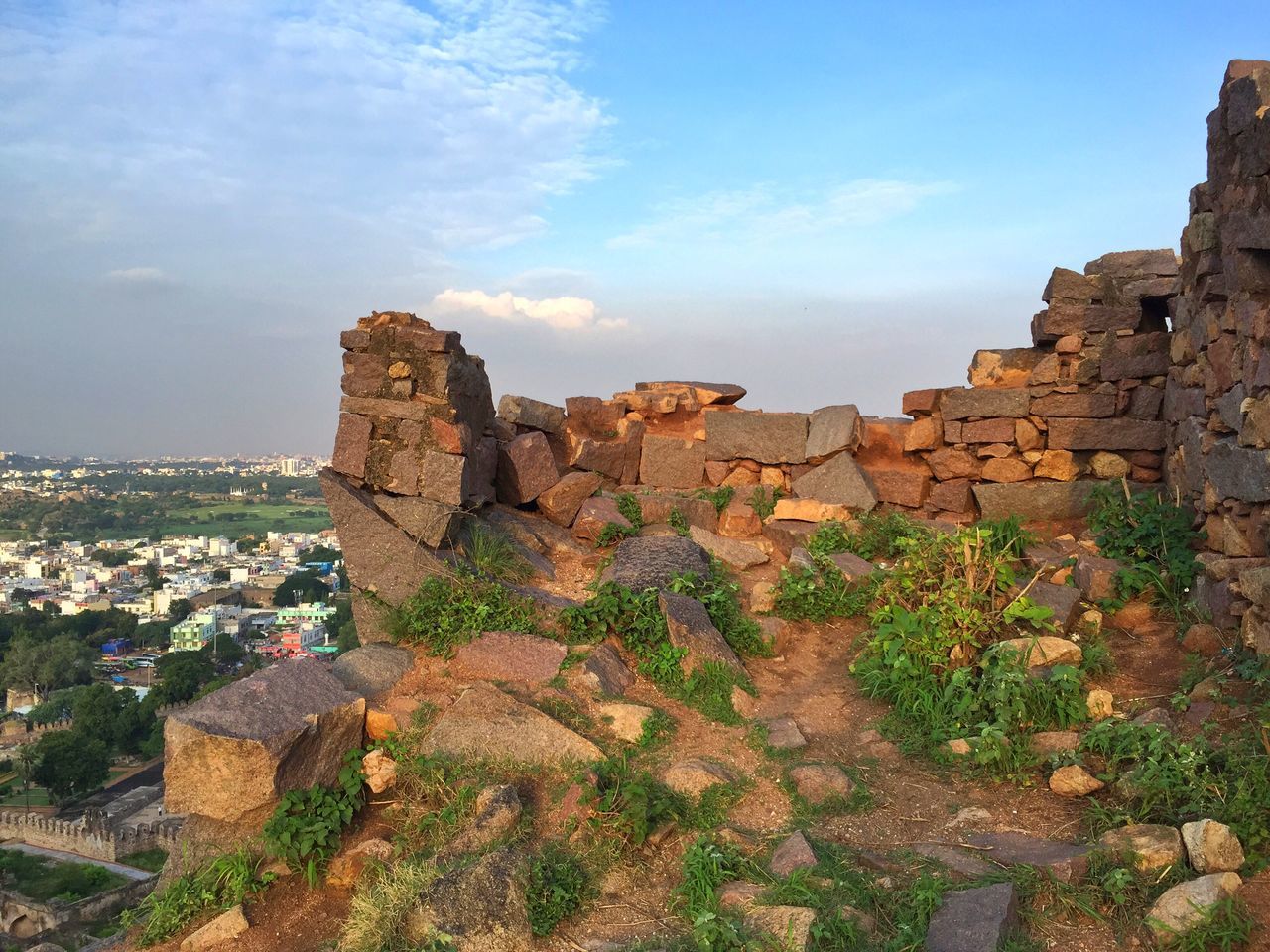 architecture, built structure, building exterior, sky, old ruin, rock - object, rock formation, history, stone wall, cloud - sky, the past, ancient, day, castle, nature, high angle view, old, wall - building feature, cloud, cliff