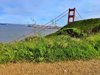 View of suspension bridge over sea