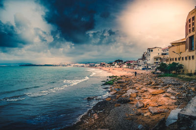 Scenic view of beach against sky during sunset