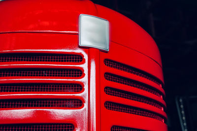 Close-up of a red antique tractor