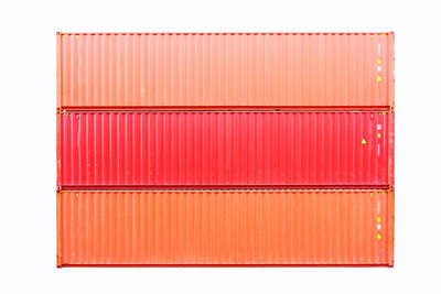 Close-up of red blinds over white background