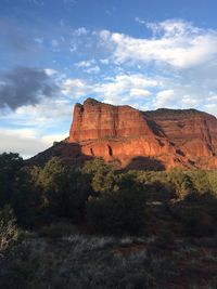 Rock formations on landscape against sky