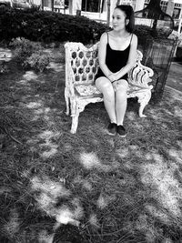 Full length of young woman standing on ground