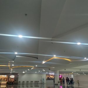 People in illuminated airport at night