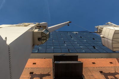 Low angle view of traditional windmill against sky