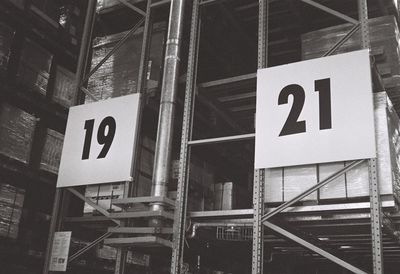 Low angle view of number on shelves in warehouse