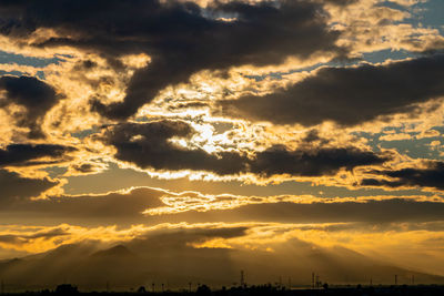 Low angle view of dramatic sky during sunset