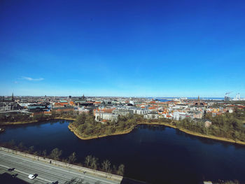 High angle view of townscape against clear blue sky