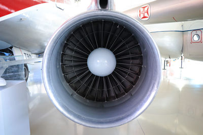 Close-up of airplane at airport runway