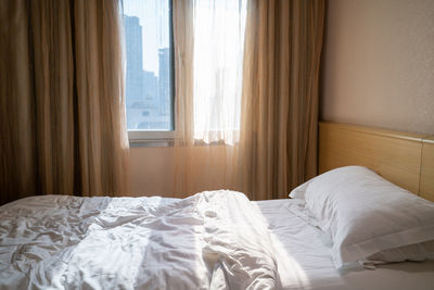 White curtain on bed at home