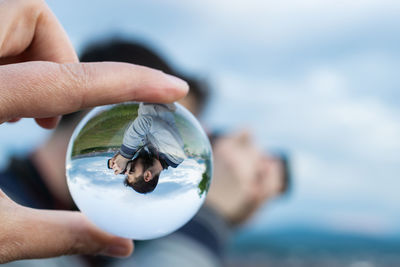 Close-up of man holding hands