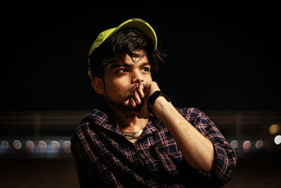 Portrait of young man looking away