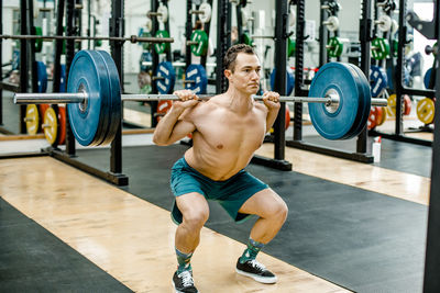 Man doing weight exercise at gym