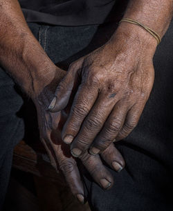 Close-up of man holding hands