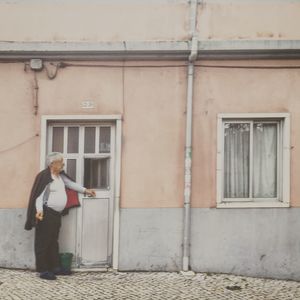 Woman standing on sidewalk