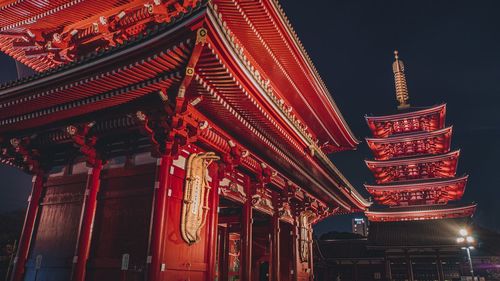 Low angle view of illuminated building at night