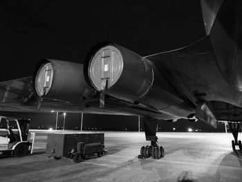 Airplane at airport runway at night