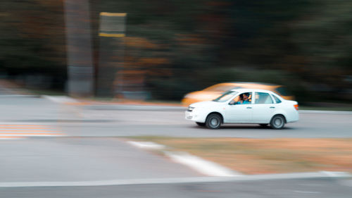 Blurred motion of car on road