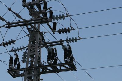 Low angle view of telephone line against clear sky