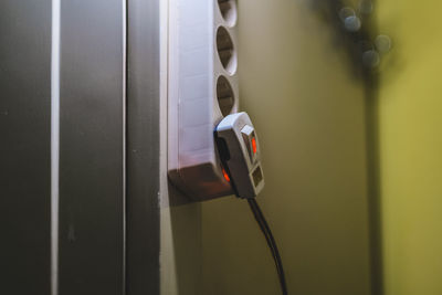 Close-up of camera on wall