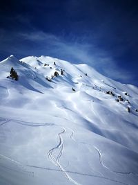 Scenic view of snowcapped mountain against sky