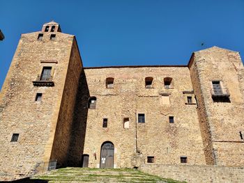 Low angle view of historic building against clear sky