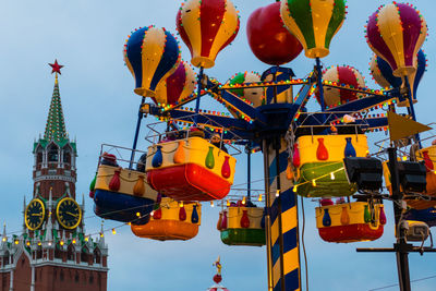 Low angle view of ferris wheel against sky