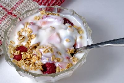 Close-up of yogurt with granola and berries in bowl