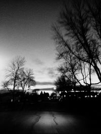 Silhouette bare trees against sky