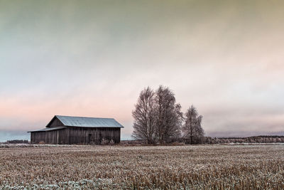 House on field against sky