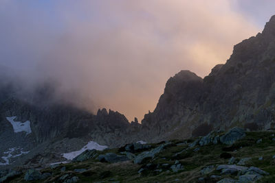 Scenic view of snowcapped mountains against sky during sunset