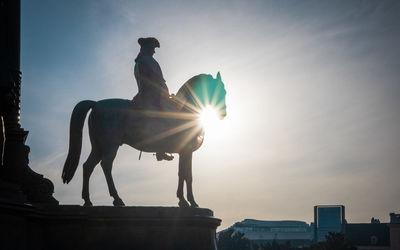 Low angle view of statue against sky