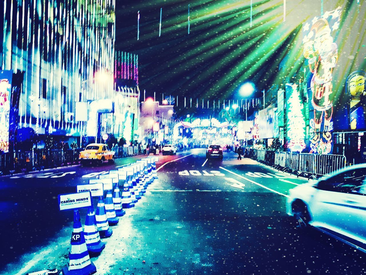 VIEW OF CITY STREET DURING NIGHT