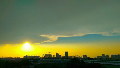 Cityscape against sky during sunset