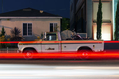 Vintage classic american muscle pick up truck car and light trails in venice beach, california 